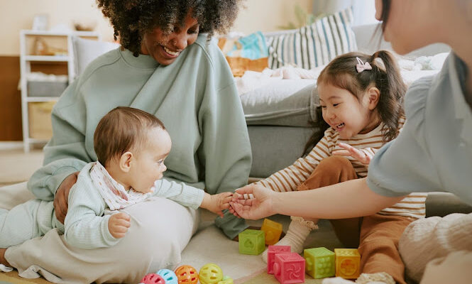 Caregiver helping children feel safe and settled during daycare