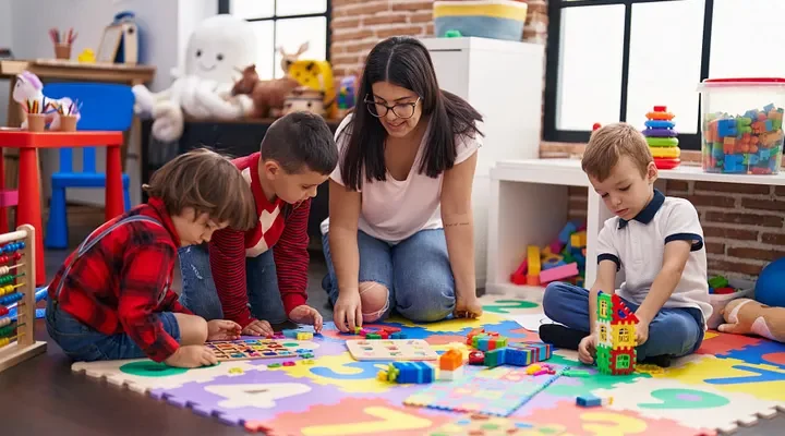 Children developing social and emotional skills through play at a quality childcare centre